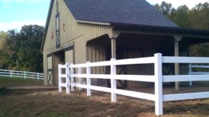 split-rail-fencing beside a barn