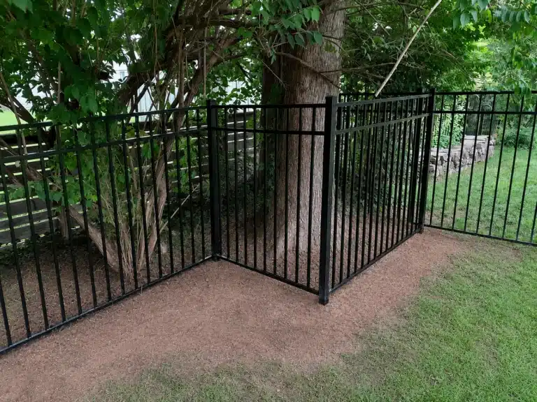 54-inch three-rail aluminum fence built around mature trees in a Severna Park, MD backyard.