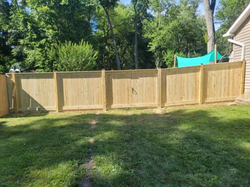 six inch privacy wood fence of a yard