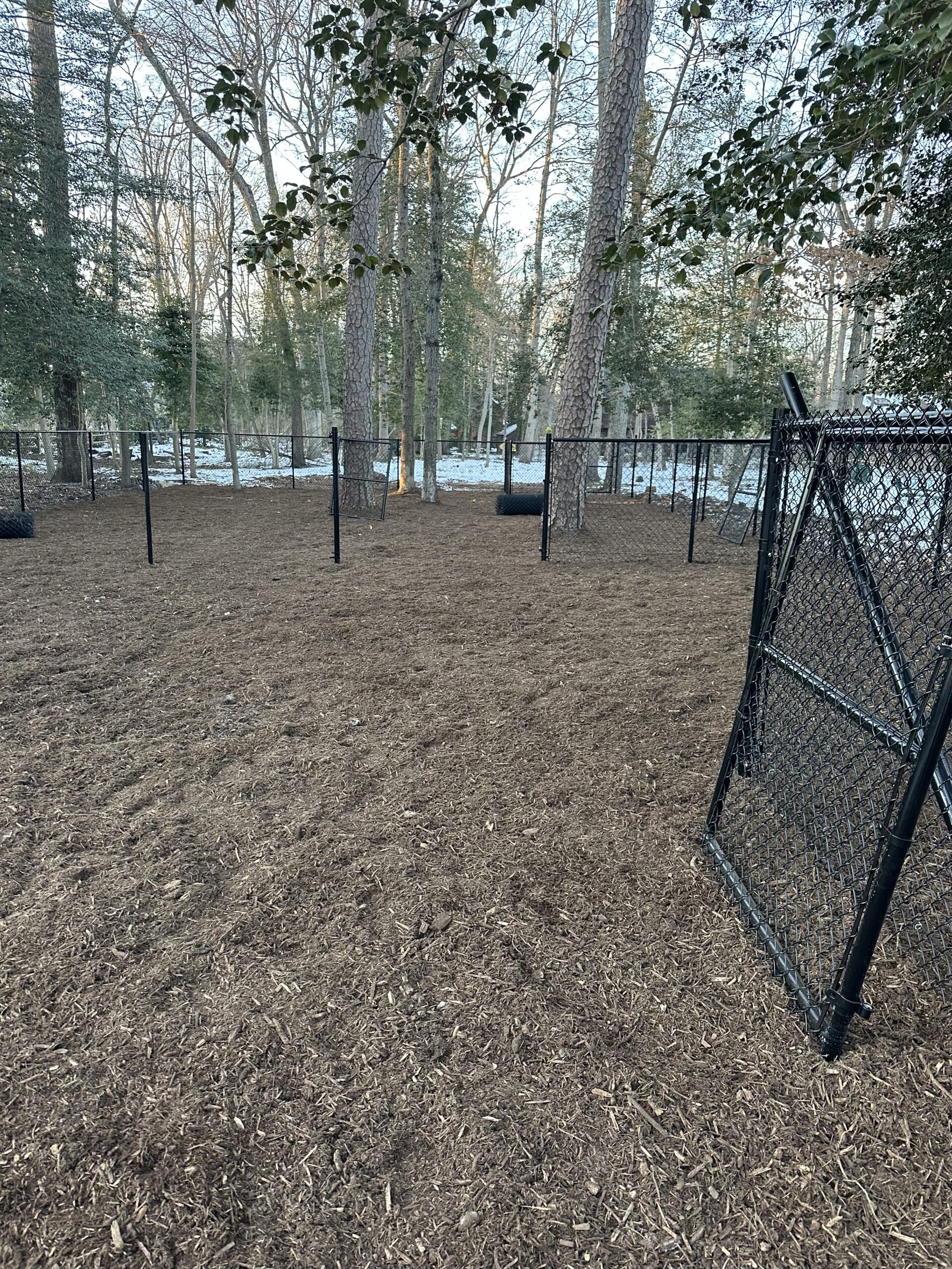 fenced dog park space with black chain link panels in Pasadena MD