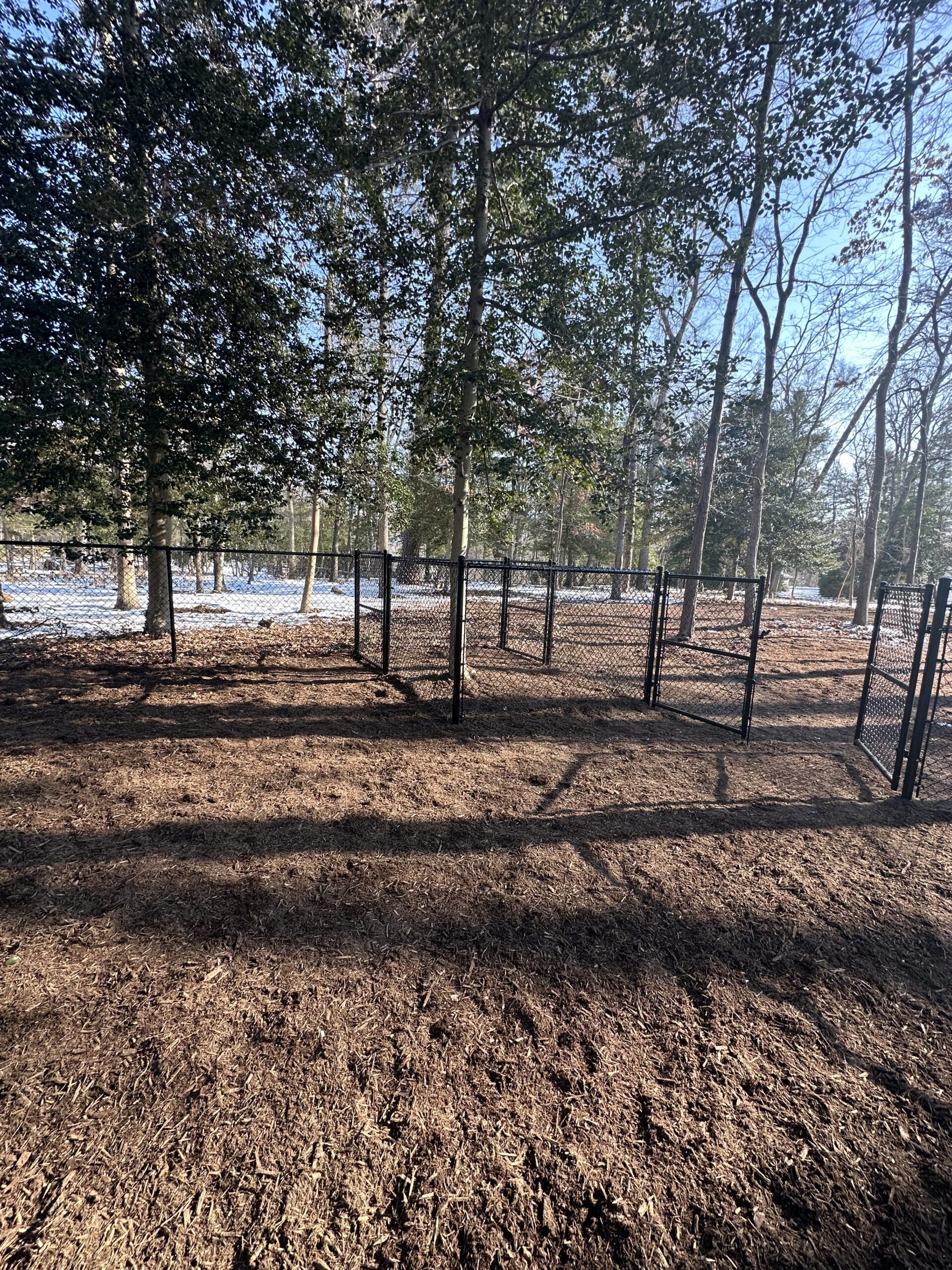 chain link fencing creating multiple sections inside a Pasadena Maryland dog park