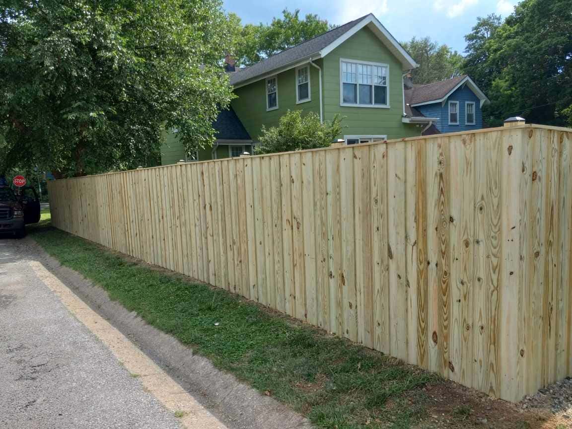 newly built wooden privacy fence with gate in Severna Park Maryland