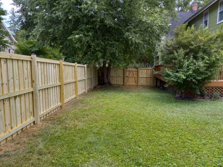 pressure-treated wood gate and fence installed beside a home in Severna Park MD