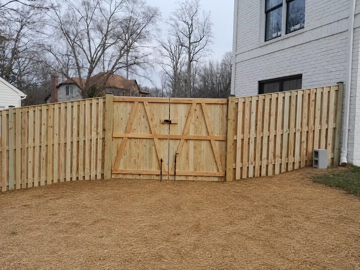 Wood privacy fence gate installed beside a home in Severna Park, MD.