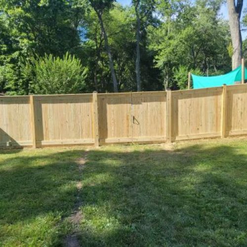 six inch privacy wood fence of a yard