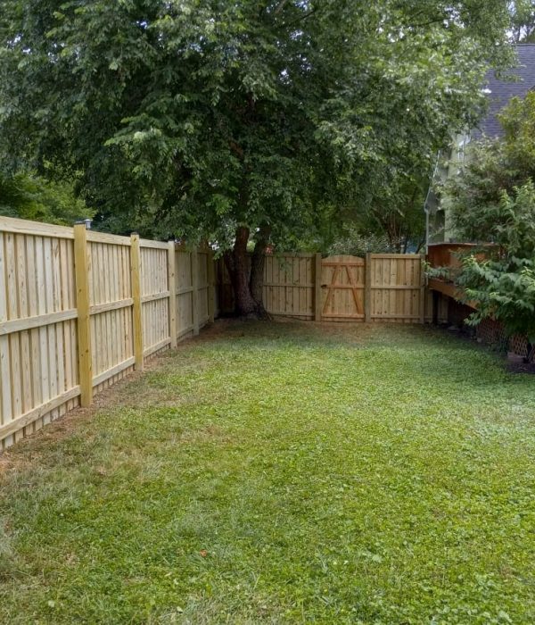 pressure-treated wood gate and fence installed beside a home in Severna Park MD