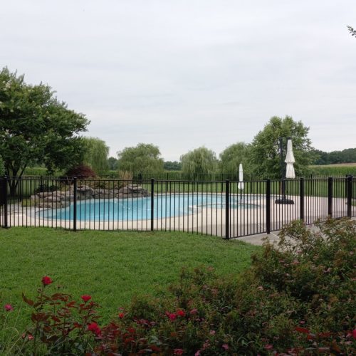 aluminum wrought iron fence around a pool