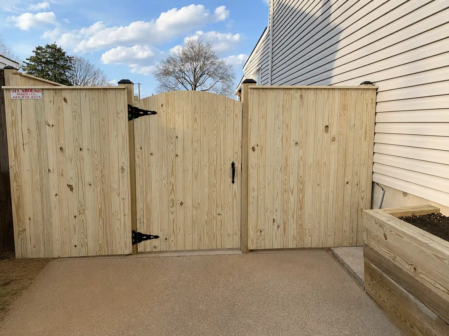 Wood fence gate entry for a fence repair and replacement project in Severna Park, MD.