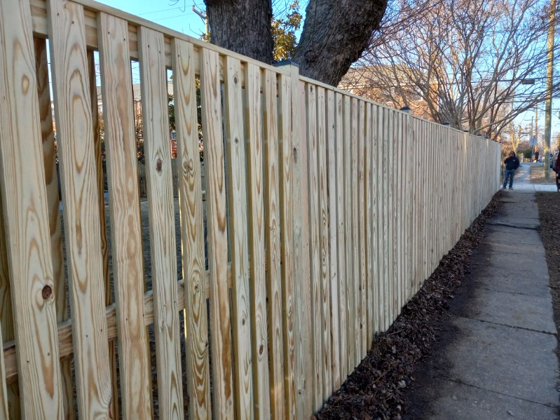 pressure-treated wood shadowbox fence installed along a residential yard in Pasadena MD