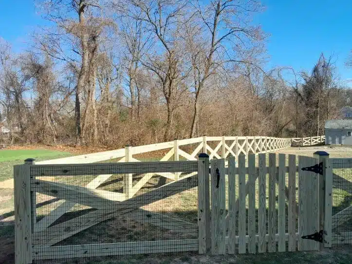 fresh pressure-treated crossbuck fence with center gate in Millersville Maryland