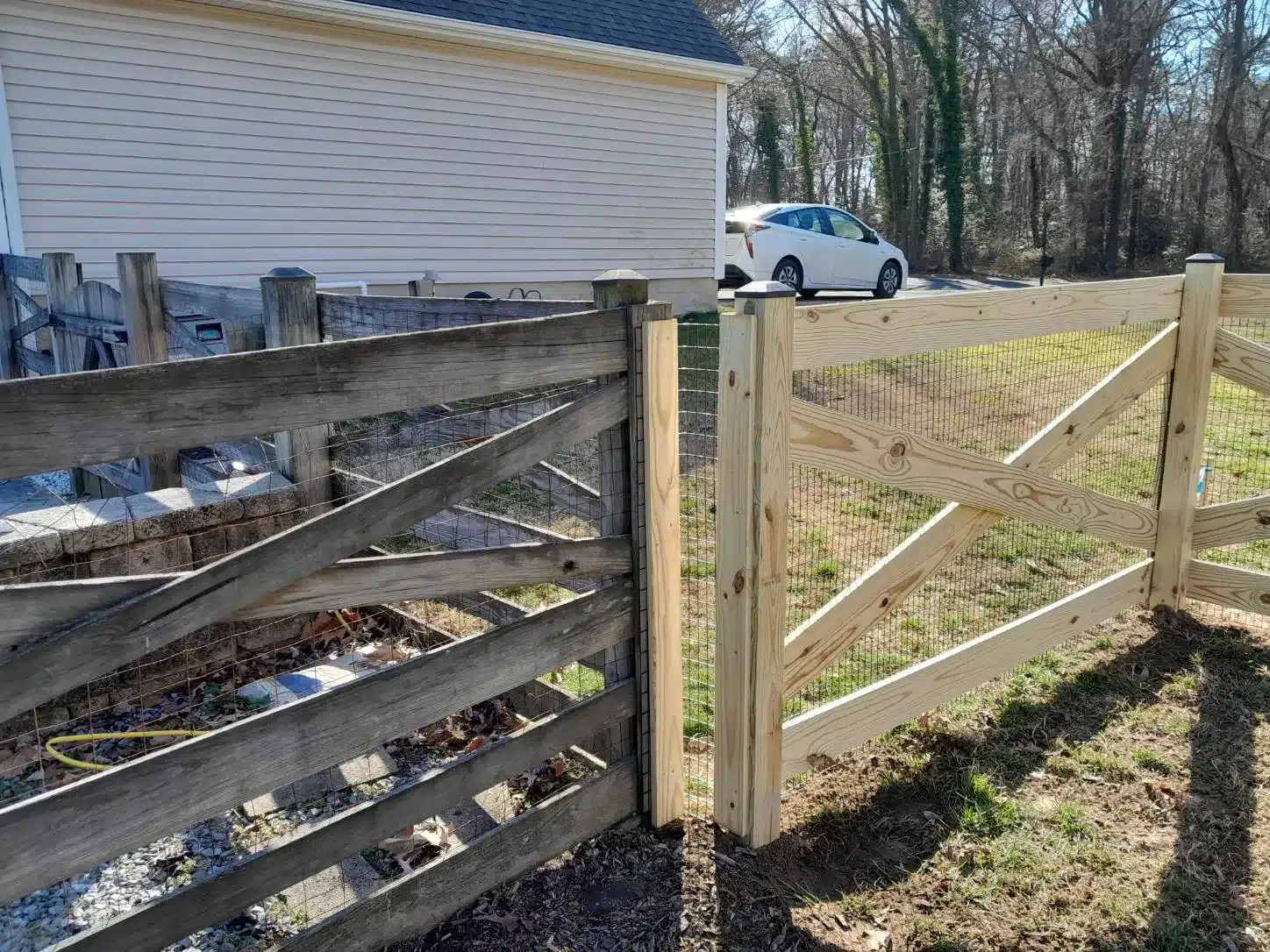 wooden crossbuck fence bordering a residential property in Millersville MD