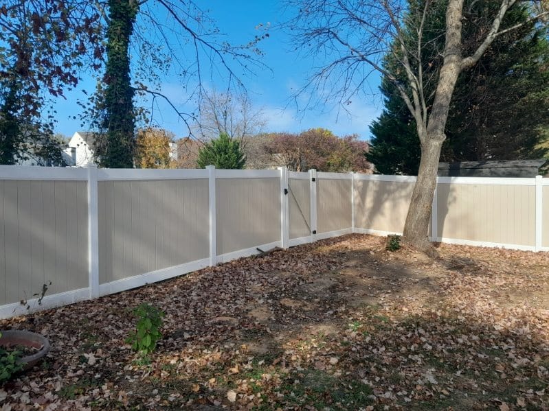 clean white and tan vinyl privacy fencing installed in an Odenton MD neighborhood