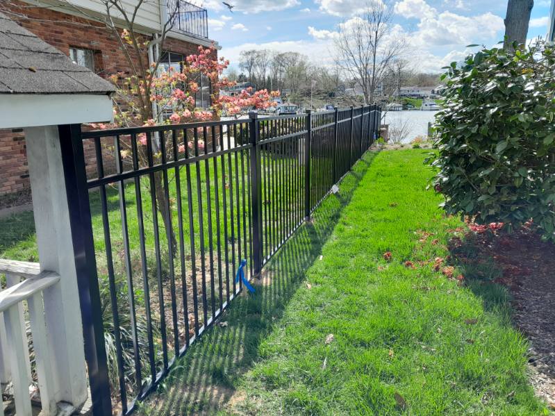 long black aluminum fence running along a residential property in Arnold Maryland