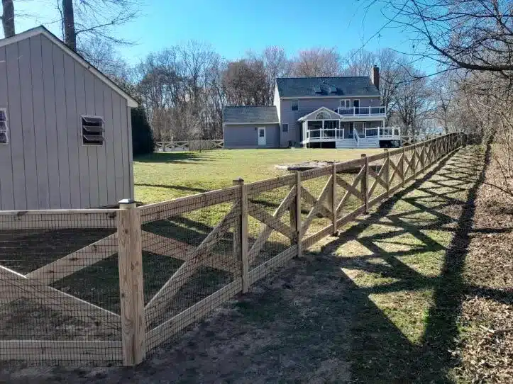 wood crossbuck fence running along a suburban yard in Millersville MD