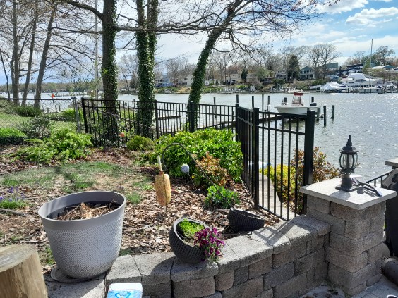 black aluminum fence installed along a waterfront yard in Arnold Maryland