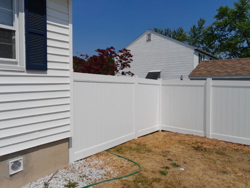 clean white vinyl fence providing privacy for a Ferndale MD home