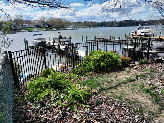 black aluminum fence protecting a waterfront property with boat docks in Arnold MD