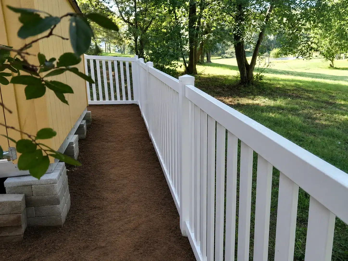 Semi-privacy vinyl fence beside a residential house in Glen Burnie, MD.
