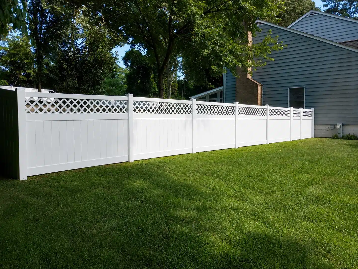 Shadowbox vinyl fence in a residential backyard in Glen Burnie, MD.