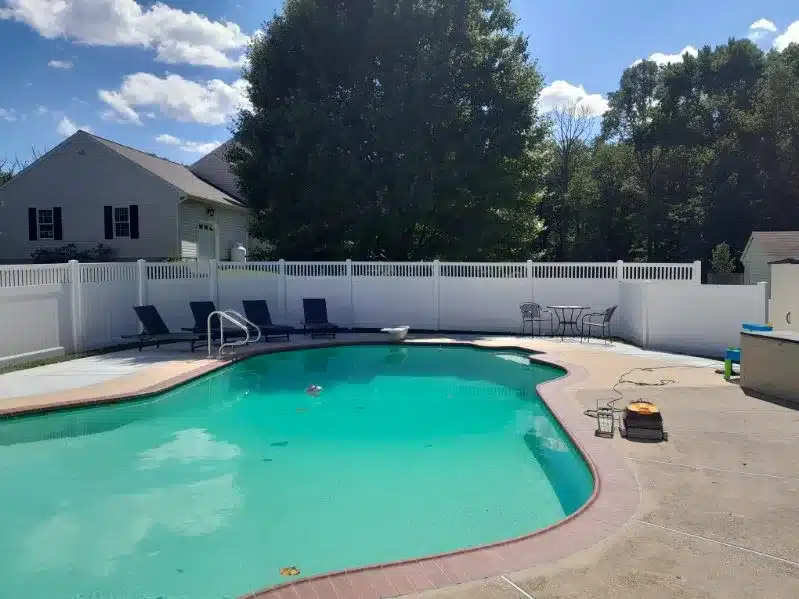 White vinyl privacy fence enclosing a residential swimming pool in Severna Park, Maryland.