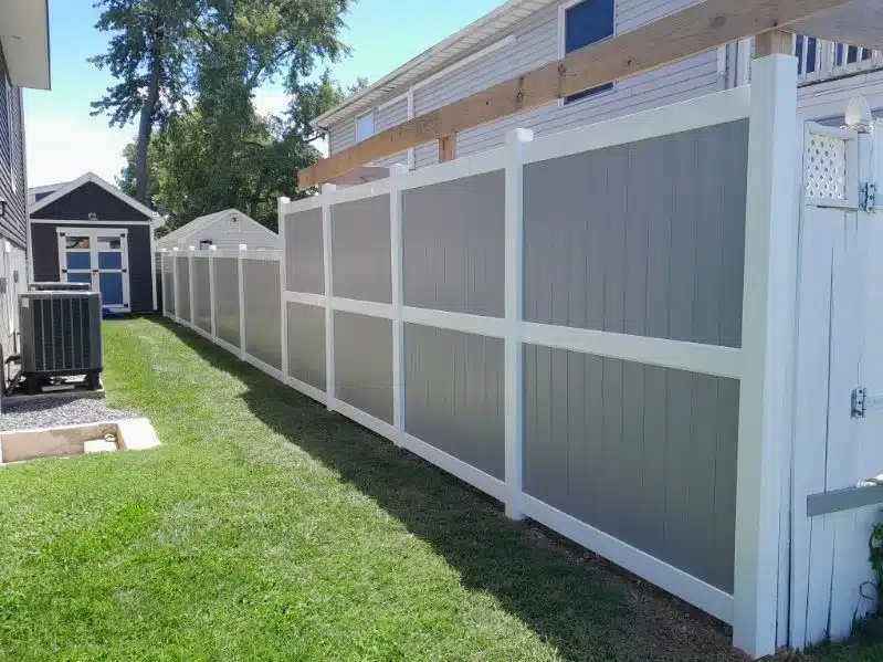 Residential privacy fence in Maryland showing a maintained fence line beside a backyard home.