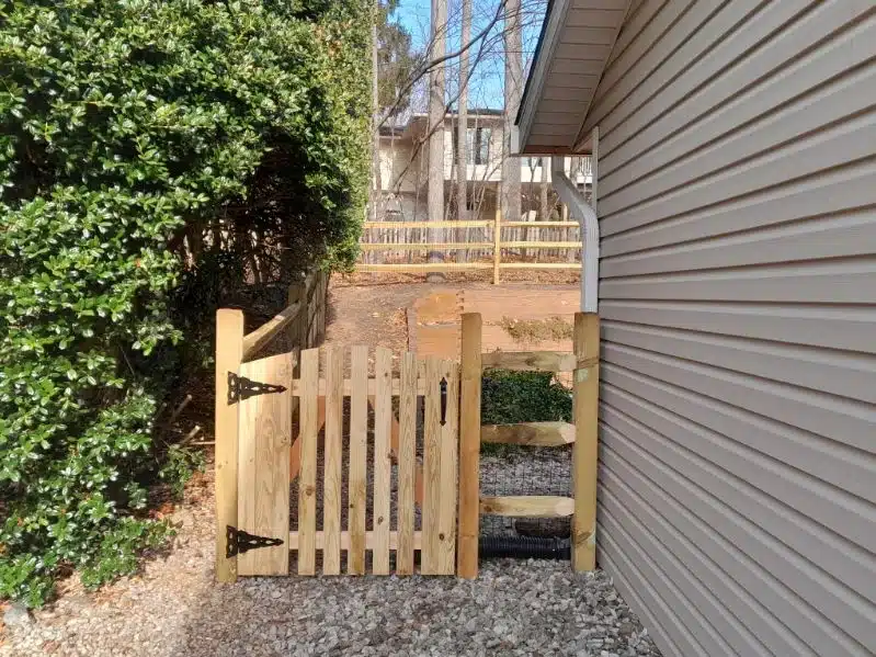 Welded-wire split-rail fence along a residential side yard in Crownsville, Maryland