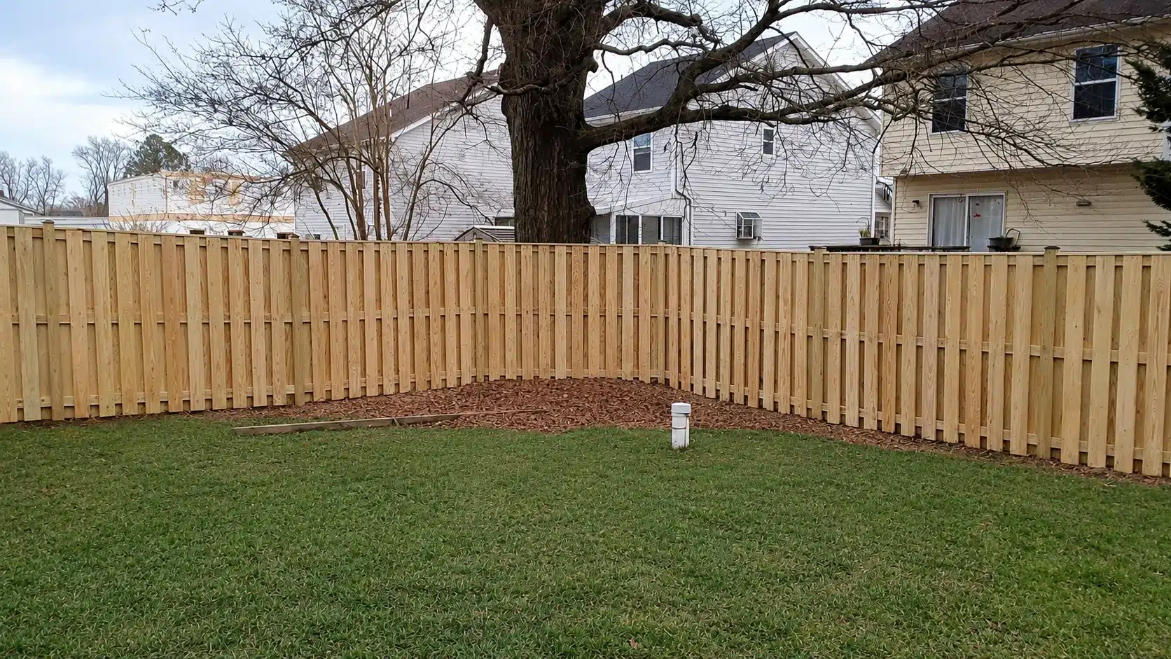 Shadowbox wood privacy fence installed along a residential side yard in Severna Park, MD.
