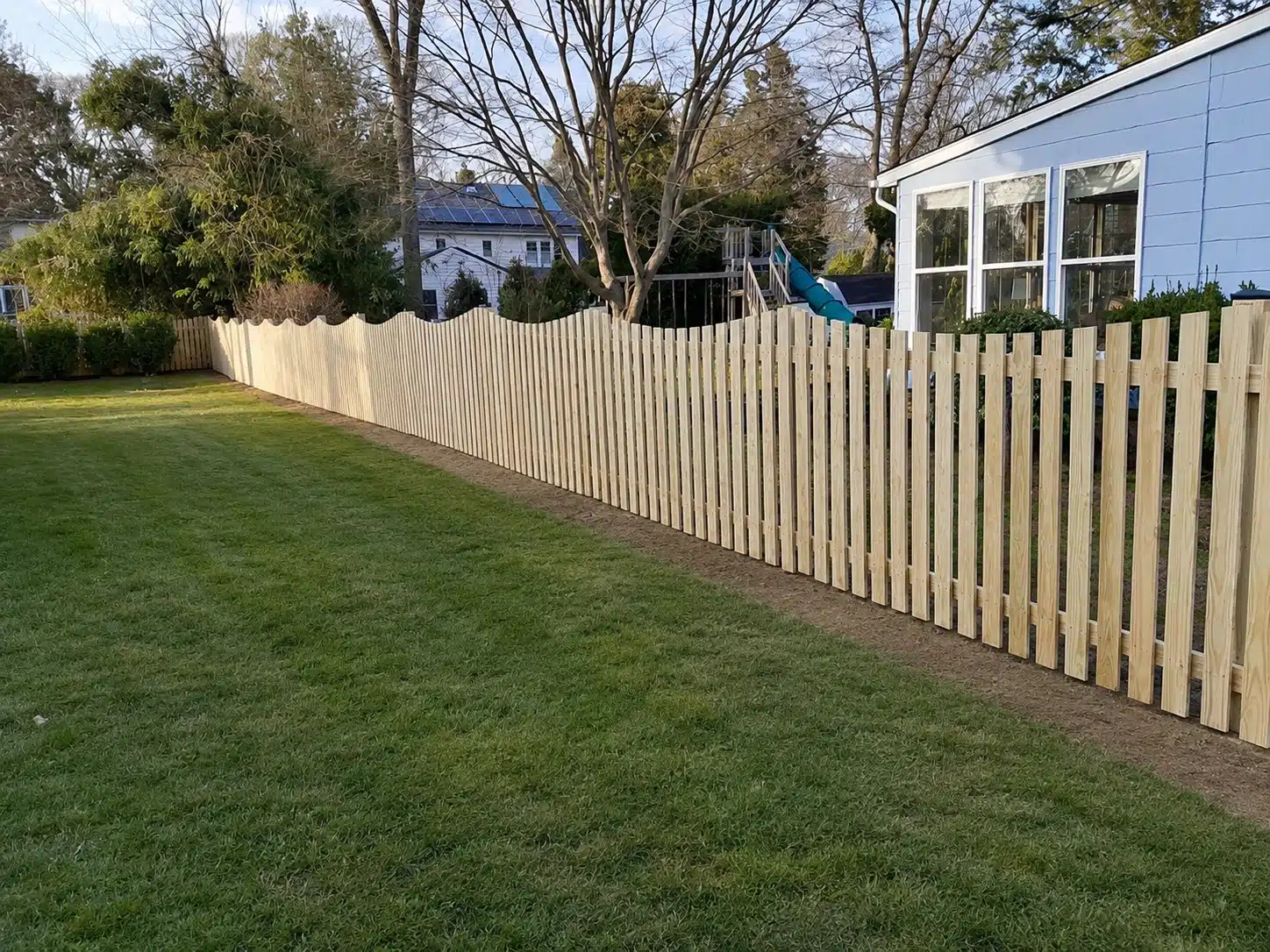 Shadowbox wood fence installed along a residential side yard in Severna Park, MD.