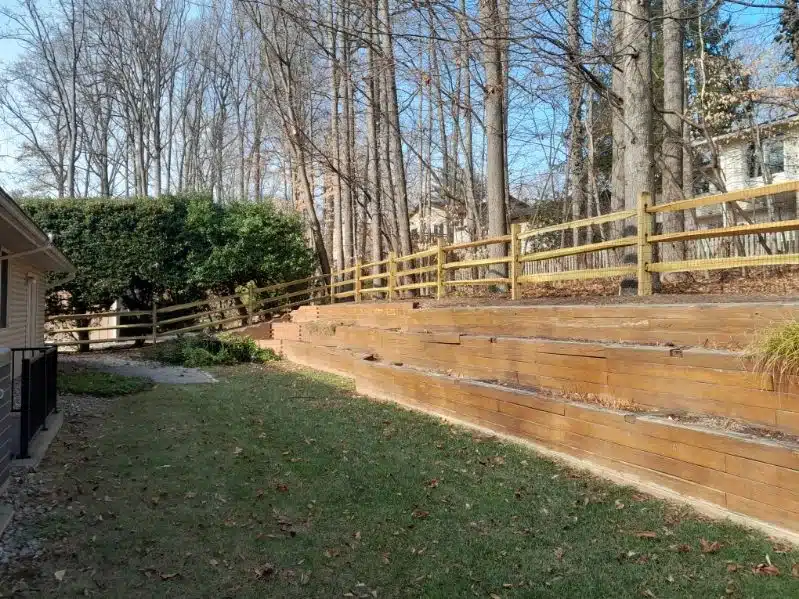 Light wood split-rail fence and gate surrounding a yard in Crownsville, Maryland
