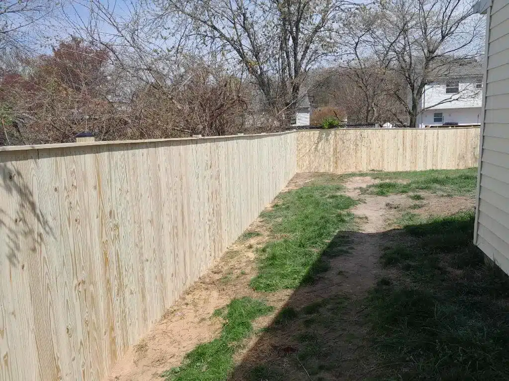 New wooden privacy fence enclosing a residential backyard in Severna Park, Maryland.